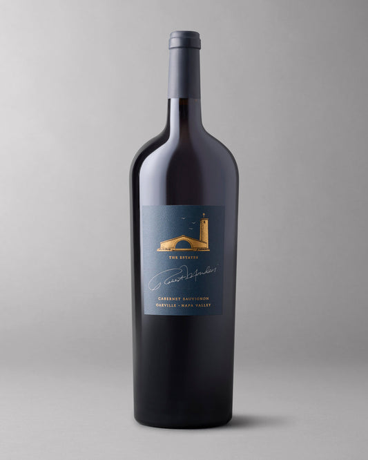 A bottle of 2018 The Estates Cabernet Sauvignon Oakville 1.5L on a grey background.