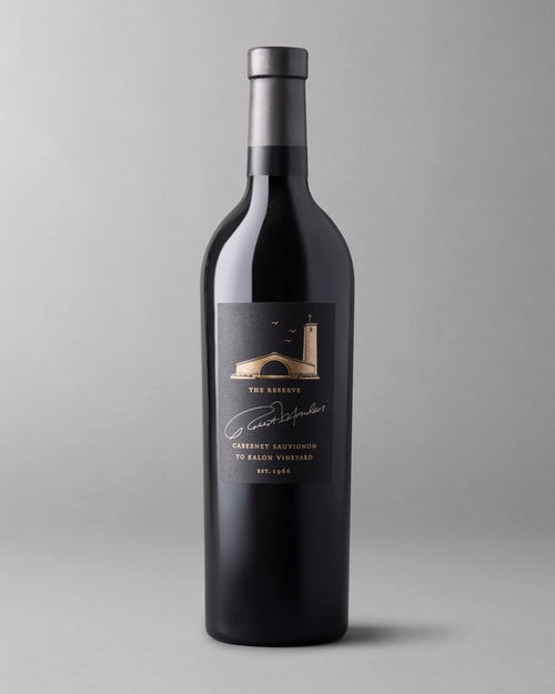 A bottle of 2018 To Kalon Reserve Cabernet Sauvignon on a grey background.