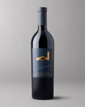 A bottle of 2021 The Estates Cabernet Sauvignon Stags Leap District on a grey background.