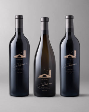 Three bottles from The Reserve collection: Cabernet Sauvignon, Red Blend, and Fume Blanc