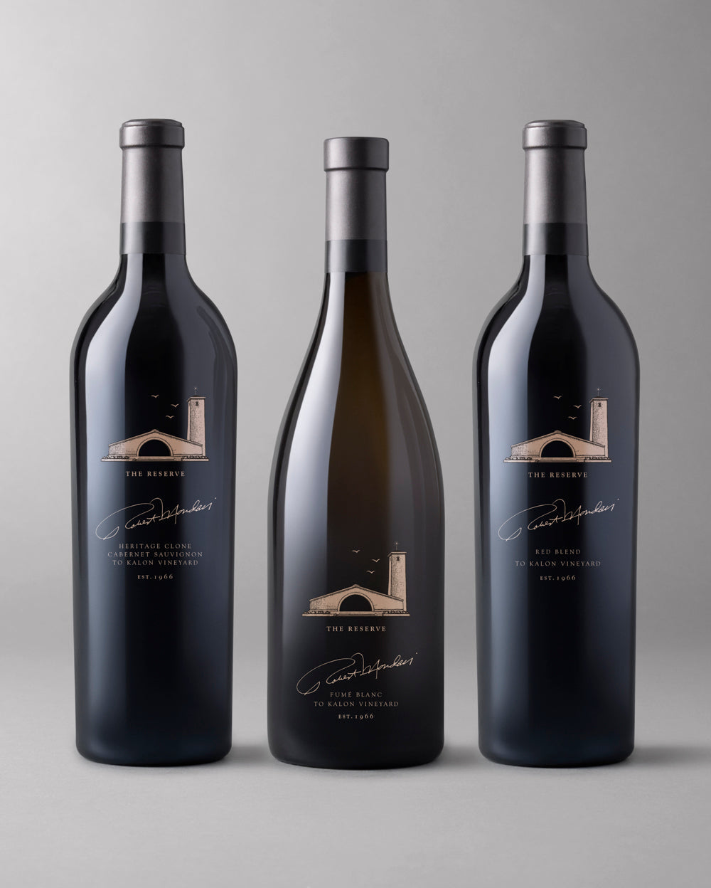 Three bottles from The Reserve collection: Cabernet Sauvignon, Red Blend, and Fume Blanc